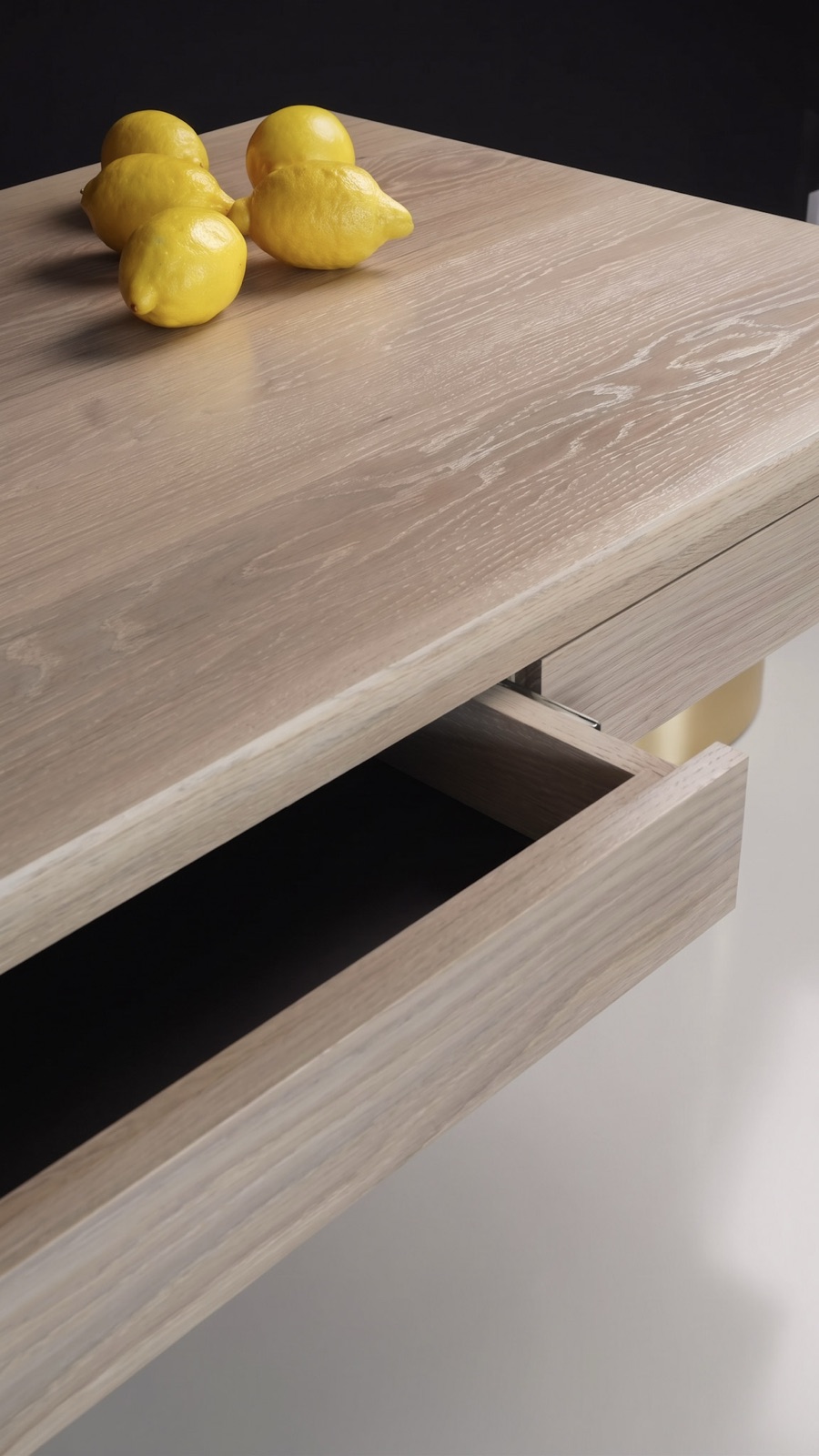 Close-up of the open drawer of the Adriana Easy Assembly, with lemons on the top