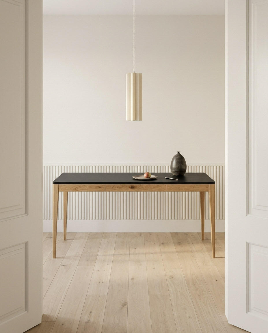 Adriana One-Piece in a pale room under a pendant light